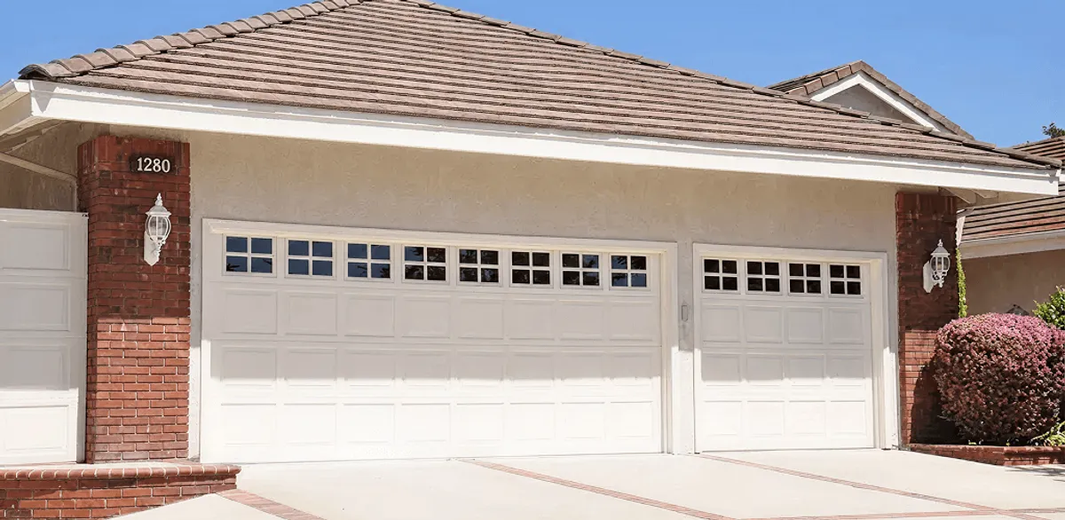 Residential garage door repair service for a double garage door in New Orleans, LA